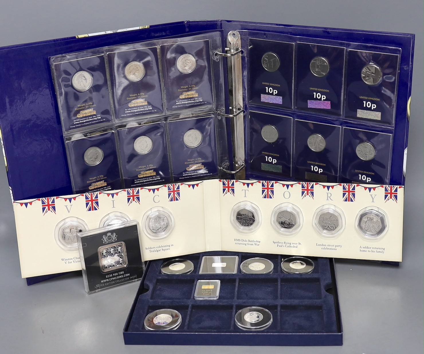 A change checker album of uncirculated coins etc.